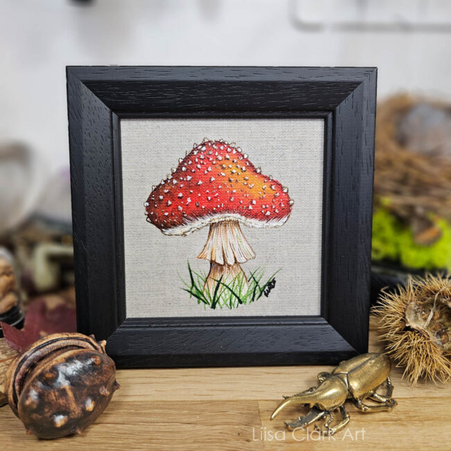 Single Fly Agaric Canvas Painting on a natural Linen canvas panel set in a Black Contemporary Black Frame by Liisa Clark