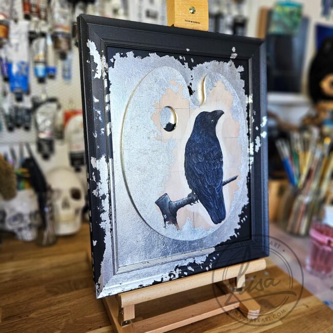 Original Painting of a Crow on an Artist palette set with Silver Leaf in a Black Frame by Liisa Clark