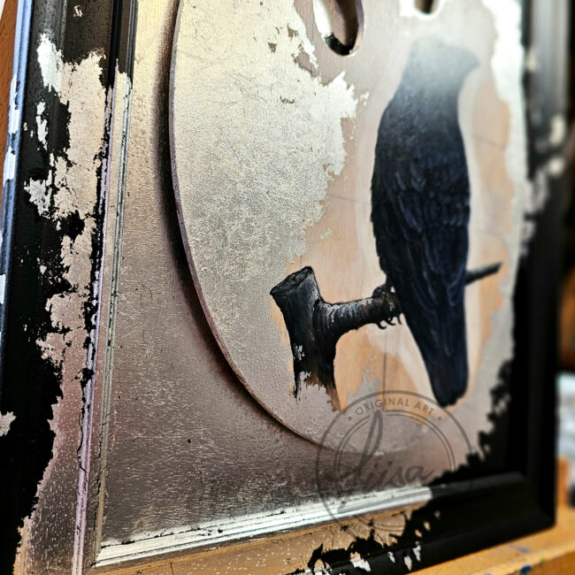 Close up of Original Painting of a Crow on an Artist palette set with Silver Leaf in a Black Frame by Liisa Clark