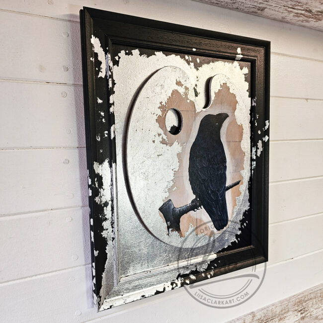 Original Painting of a Crow on an Artist palette set with Silver Leaf in a Black Frame by Liisa Clark