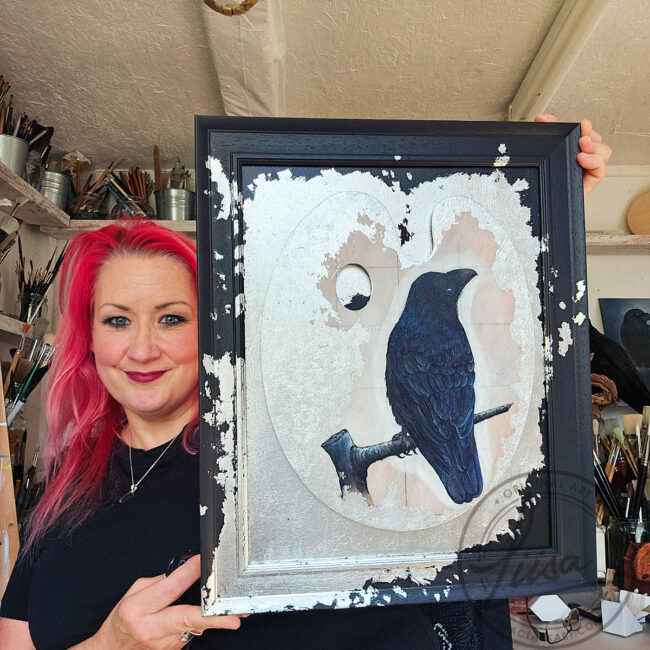 Original Painting of a Crow on an Artist palette set with Silver Leaf in a Black Frame by Liisa Clark