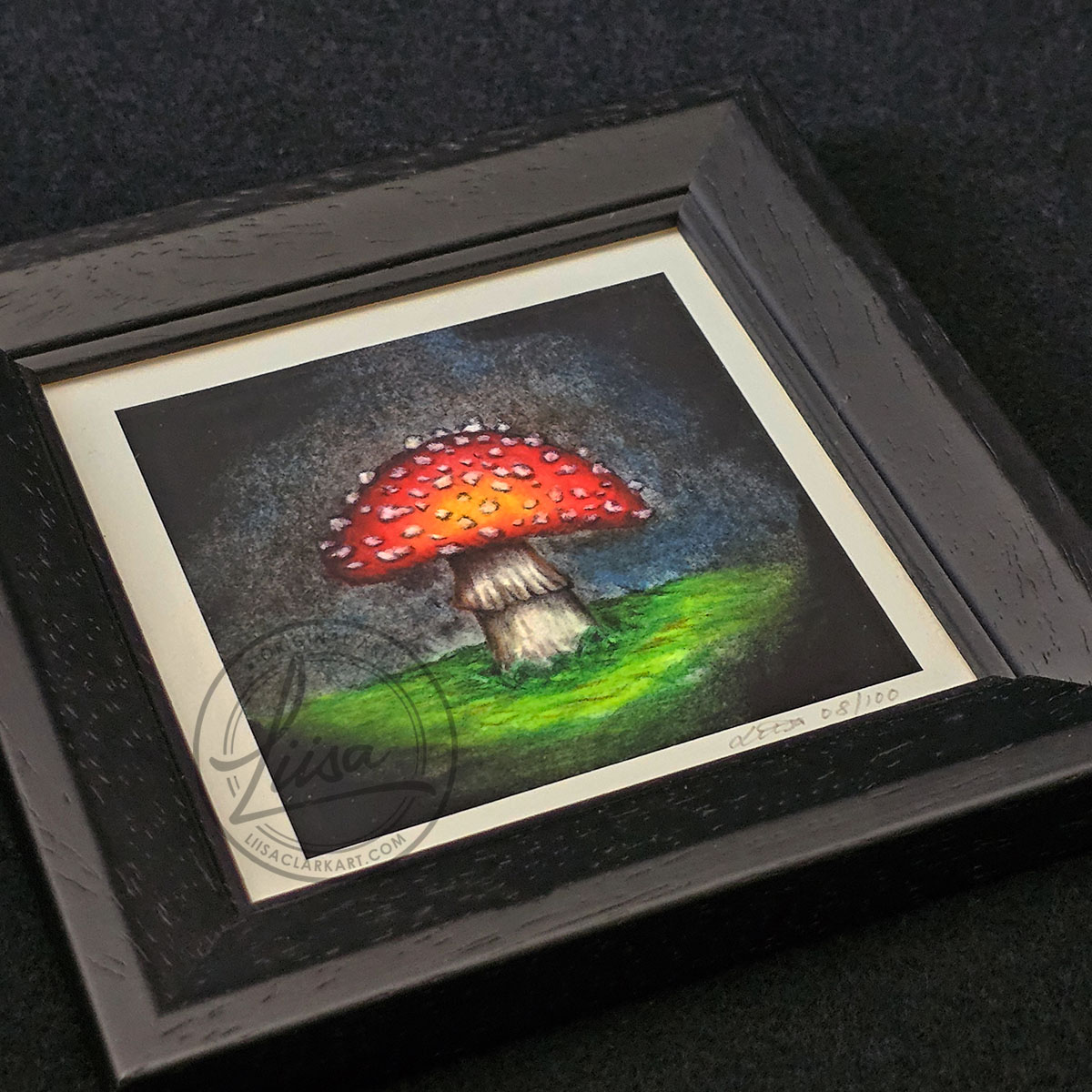 10x10cm Giclee Print Bright Toadstool in the dark in a Black Frame By Liisa Clark