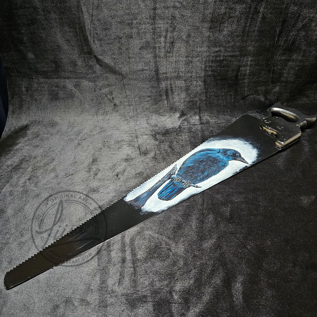 Side Angle showing texture of the Acrylic paint and the Blade on an antique saw with crow art inspired by Irish mythology and the Morrigan