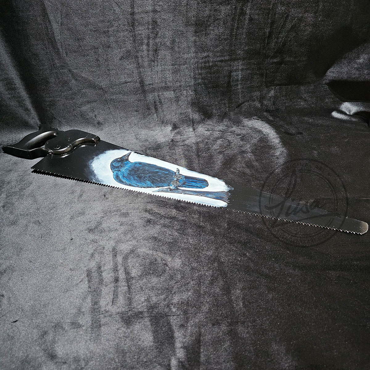 Side Angle showing texture of the Acrylic paint and the Blade on an antique saw with crow art inspired by Irish mythology and the Morrigan