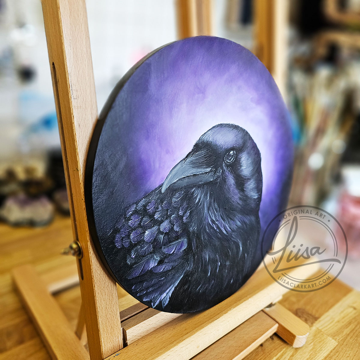 Original Oil Painting on an Artist Easel of a Crow with Violet hues part of the Corvid Chroma Series By Liisa Clark