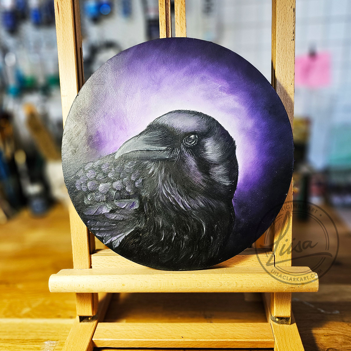Original Oil Painting on an Artist Easel of a Crow with Violet hues part of the Corvid Chroma Series By Liisa Clark