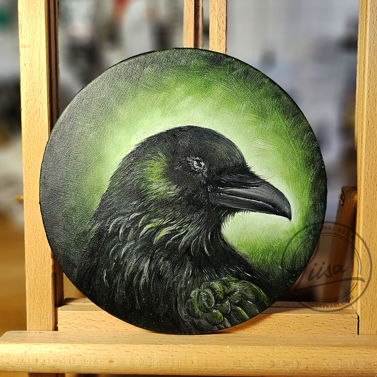 Set on an Easel An Original Oil Painting titled Verdant Green on a Round Canvas Panel part of the Corvid Chroma Series Celebrating the Colours found in Corvid feathers by Liisa Clark