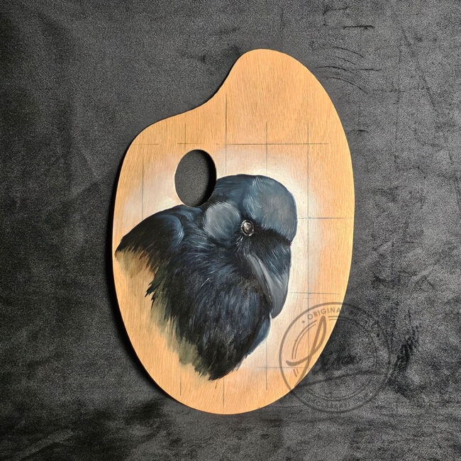 Oil painting of a crow on a wooden artist’s palette by Liisa Clark Art