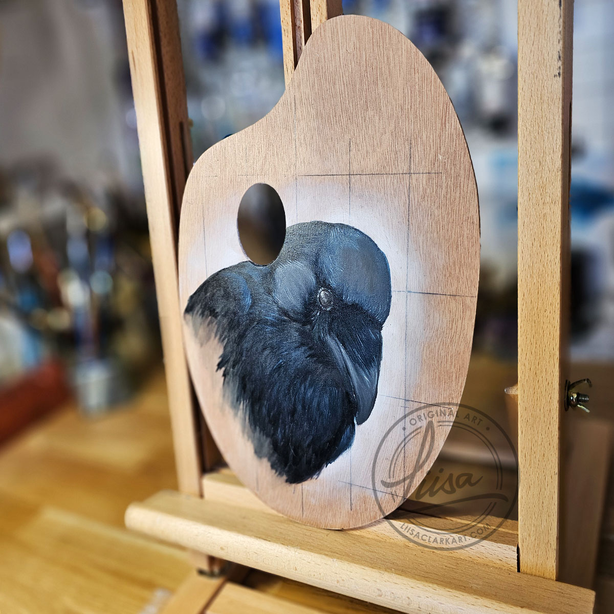 Side angle of “Direct Crow” oil painting on a birch palette by Liisa Clark Art