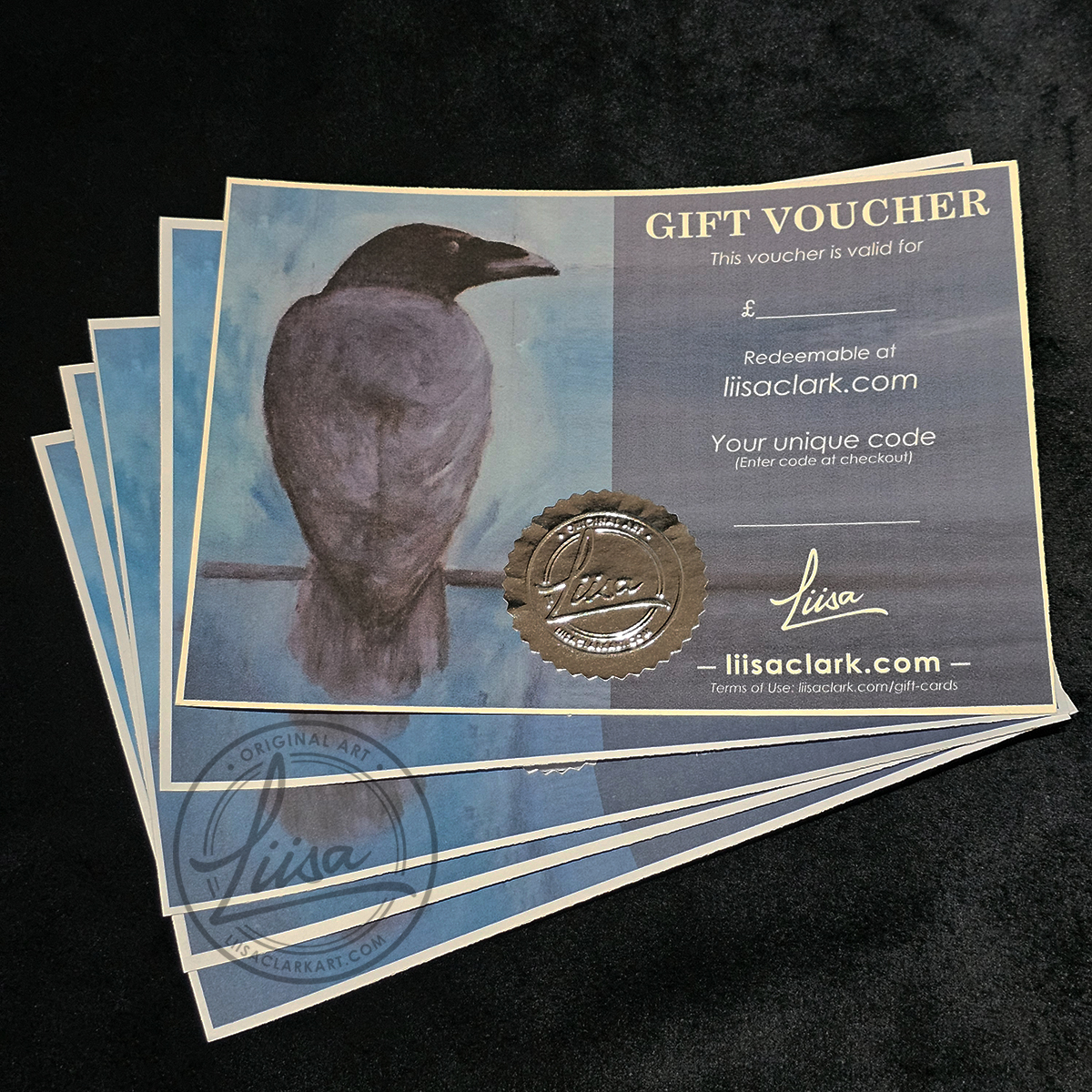 Stacked Liisa Clark Art gift vouchers featuring crow artwork, wax seal and embossed detailing, suitable for art lovers and collectors
