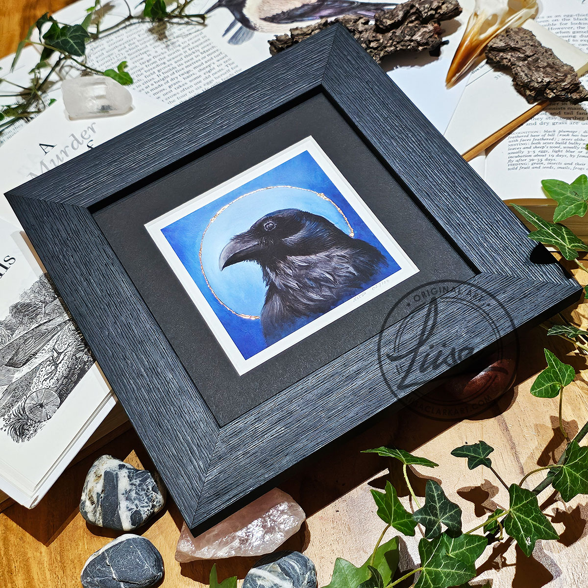 Framed limited edition raven giclée print with hand embellished copper leaf from the Blue Corvid Series by Liisa Clark Art.