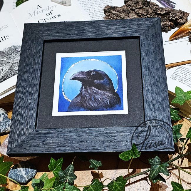 Framed limited edition raven giclée print with hand embellished silver leaf from the Blue Corvid Series by Liisa Clark Art