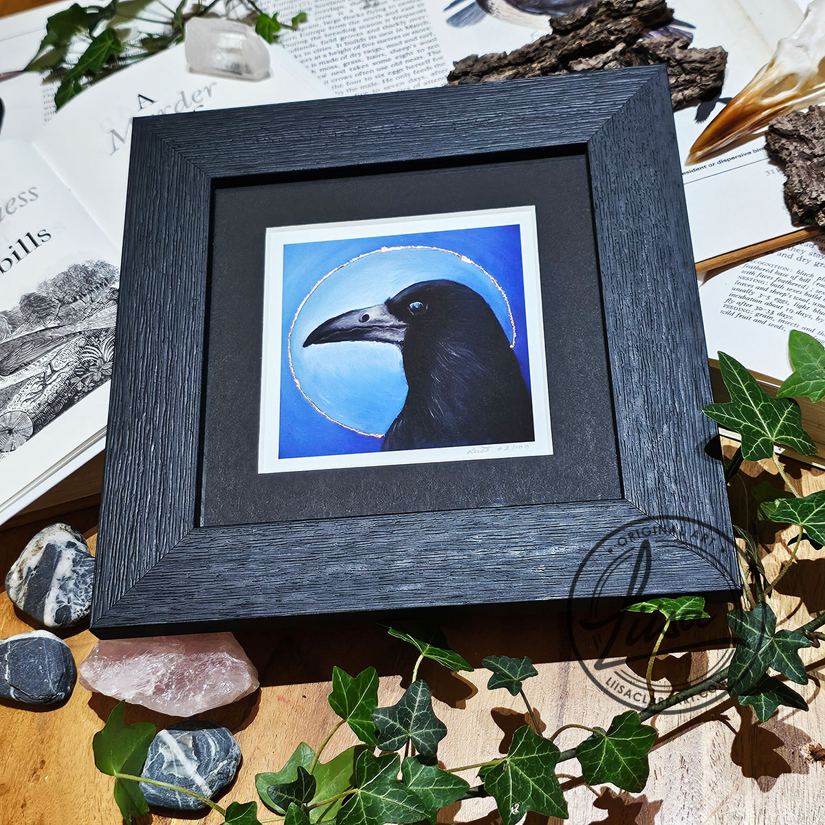 Framed limited edition rook giclée print with hand embellished copper leaf from the Blue Corvid Series by Liisa Clark Art