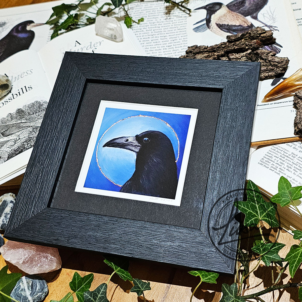 Framed contemporary rook artwork with copper leaf embellishment and blue background by Liisa Clark Art