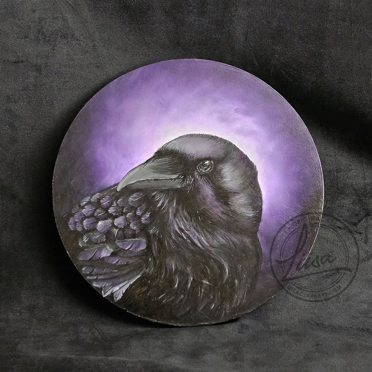 Original circular oil painting titled A Murder of Mauve by Liisa Clark Art, featuring a raven portrait with soft mauve and violet iridescent tones against a glowing purple background on a dark wood panel.