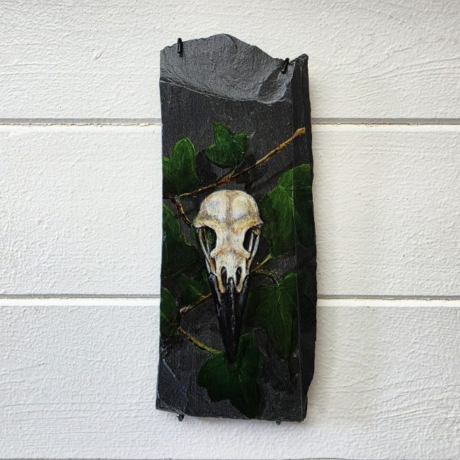 Among Ivy original crow skull painting on genuine reclaimed Welsh slate by wildlife artist Liisa Clark