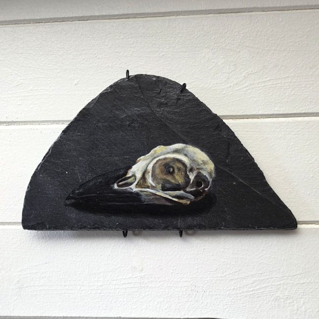The Quiet Skull original crow skull painting on genuine reclaimed Welsh slate by wildlife artist Liisa Clark