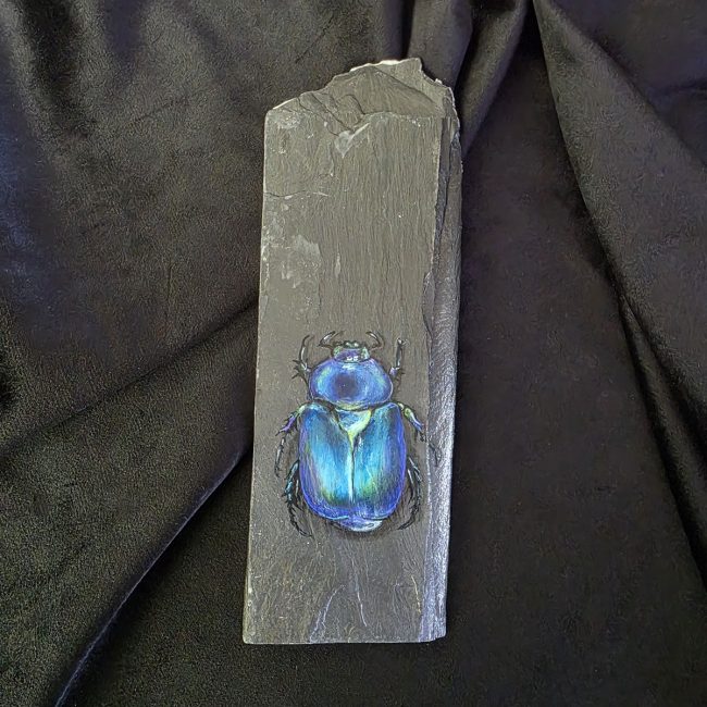 Original blue beetle painting on reclaimed slate, The Jewel of Moss and Shadow by Liisa Clark