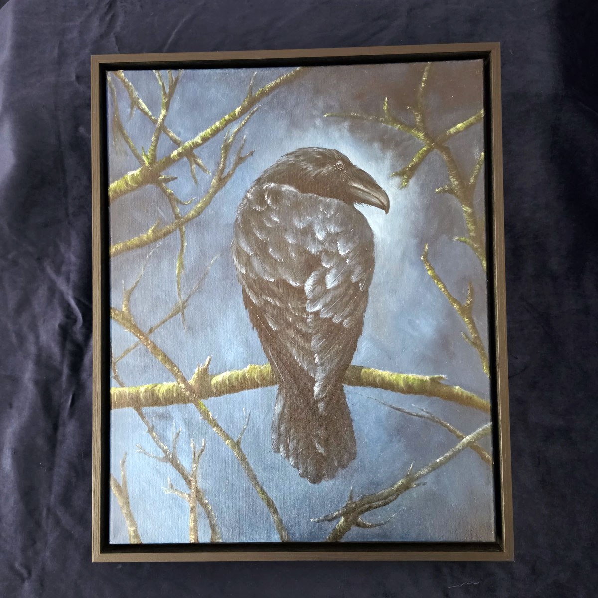 The Watchful Guardian original crow oil painting by Liisa Clark, framed against a black background